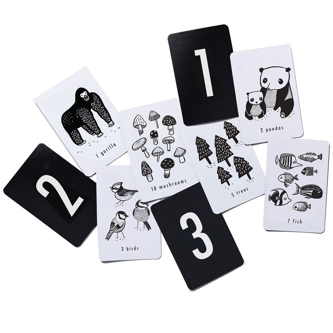 A set of black and white cards with animals and numbers on them.