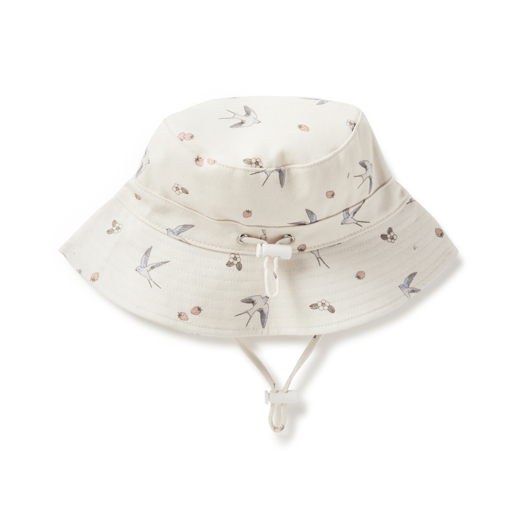 An Aster & Oak Bucket Hat - LUCKY LASTS - MEADOW & LION ONLY with flowers on it made from cotton canvas.