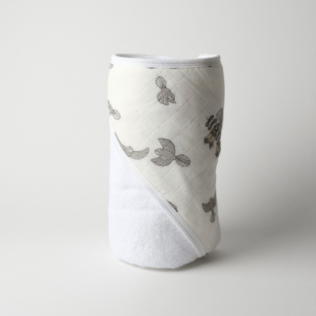 Babu-Organoc-Hooded-Baby-Towel-New-Zealand-Prints-Piwakawaka-Rolled-Up-Naked-Baby-Eco-Boutique