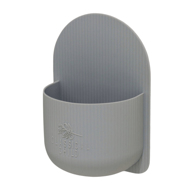 Introducing the "Classical Child" Silicone Bath Toy Caddy – LUCKY LASTS: This gray wall-mounted holder features a semicircular design, making it an ideal organizer for bath time. The caddy is embossed with "Classical Child" on the front and crafted from BPA-free silicone for safe storage.