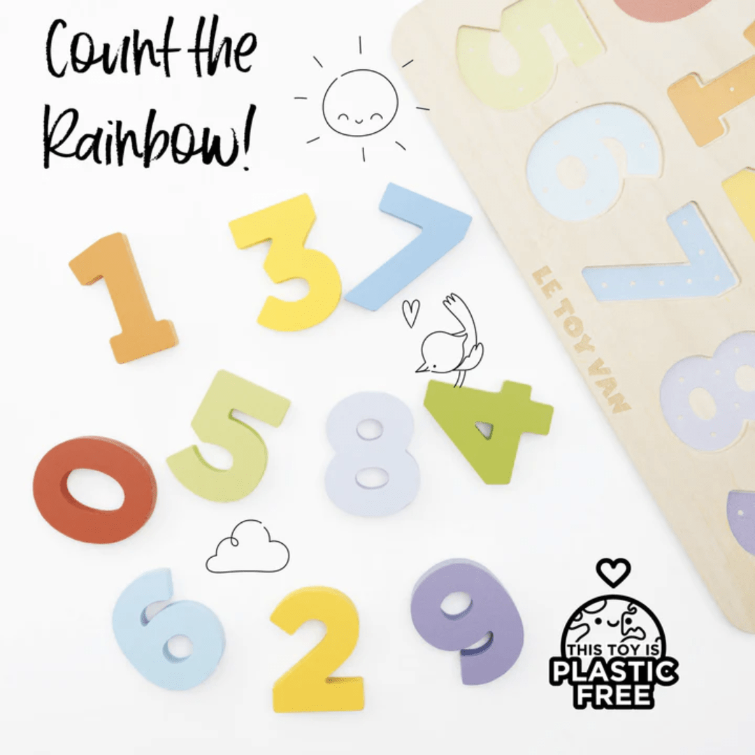 Colorful wooden number puzzle pieces and a board sit in the background. Illustrated sun, cloud, and bird designs surround the pieces. Text reads "Count the Rainbow!" and "This eco-friendly toy is plastic-free." The product shown is the Le Toy Van Figures Counting Puzzle by Le Toy Van.