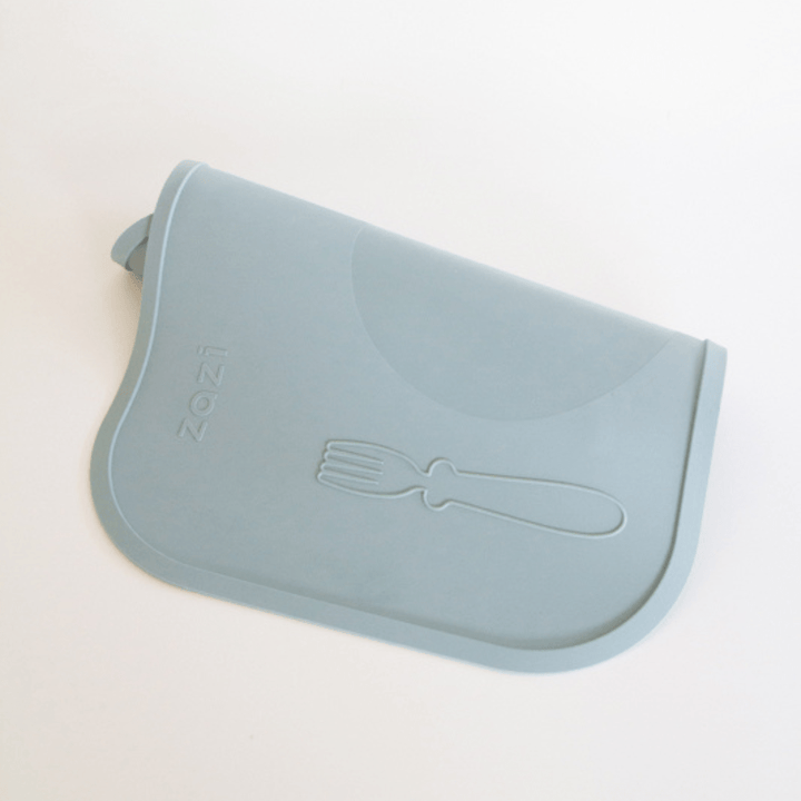 An image of a Zazi Clever Mat in light blue, made from food-grade silicone and featuring an embossed fork design.