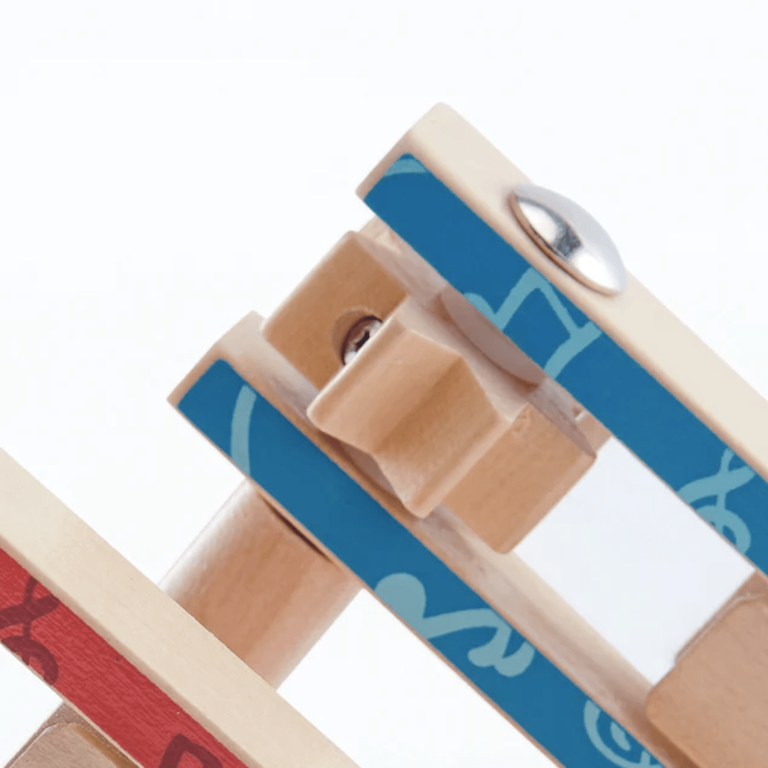 Close-up of the Hape Cheer a Long Noisemaker, crafted from sustainable materials, featuring a blue patterned connecting piece designed to enhance hand-eye coordination.