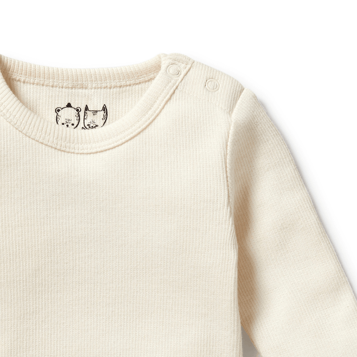 Close-up of the Wilson & Frenchy Organic Rib Long Sleeved Onesie in fawn and pink, featuring two small animal faces printed near the collar and buttons on the shoulder. Made from GOTS-certified organic cotton.