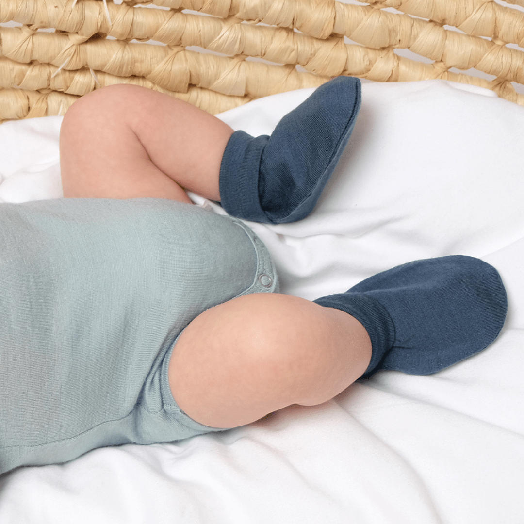 Cute-Baby-Legs-Wearing-Babu-Merino-Baby-Booties-Babu-Denim-Naked-Baby-Eco-Boutique