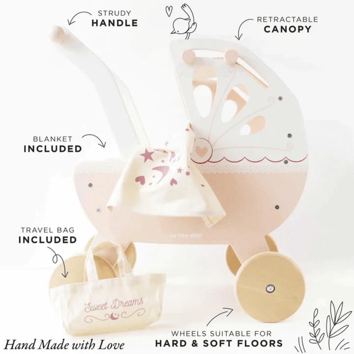 A Le Toy Van Sweet Dreams Doll Pram with a pink and white design.