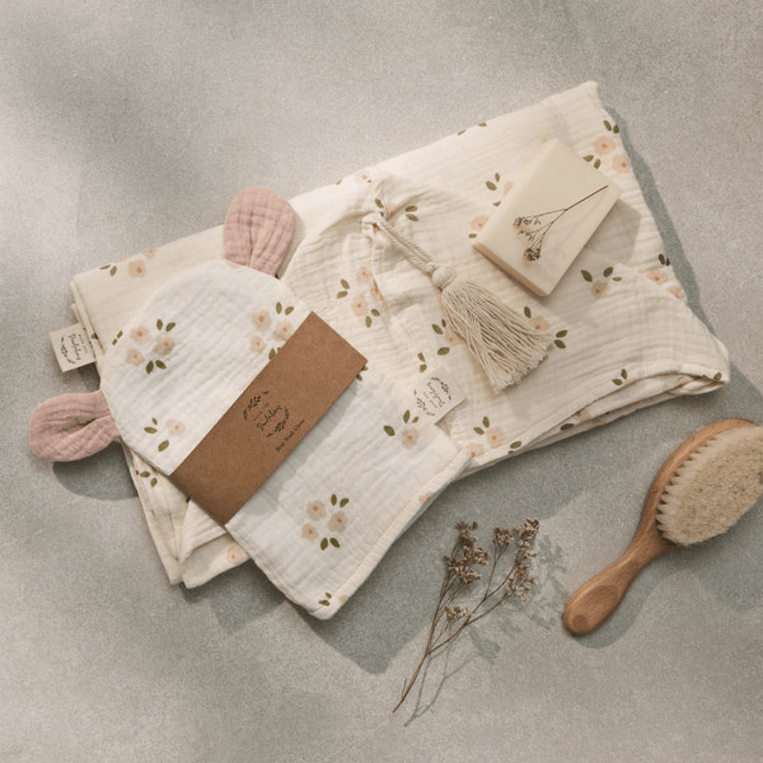 Flatlay-Of-Over-The-Dandelions-Organic-Muslin-Bear-Washcloth-Daisy-With-Muslin-Towel-Naked-Baby-Eco-Boutique