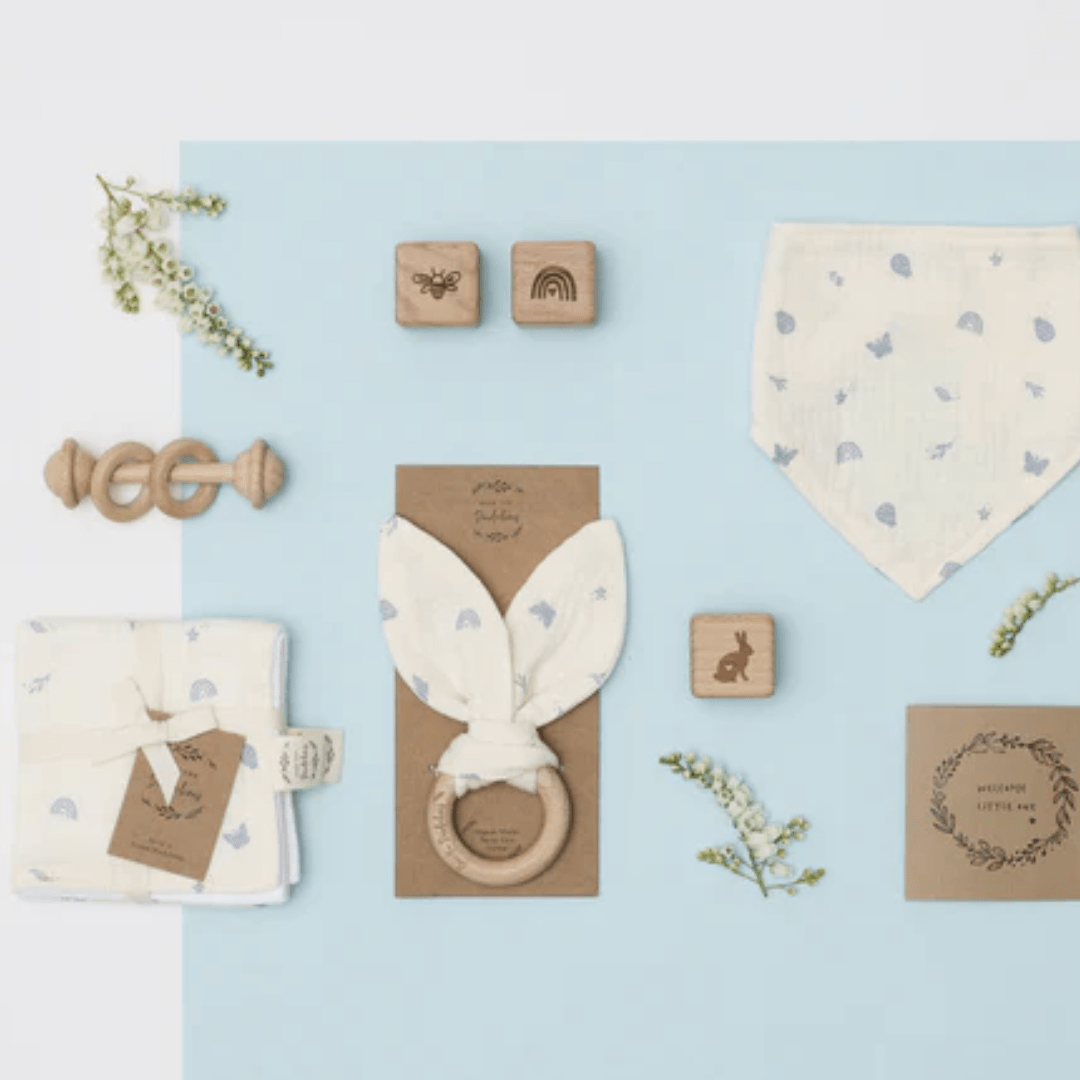 Flatlay-Of-Over-The-Dandelions-Organic-Muslin-Bunny-Ears-Teether-Enchanted-Garden-Naked-Baby-Eco-Boutique