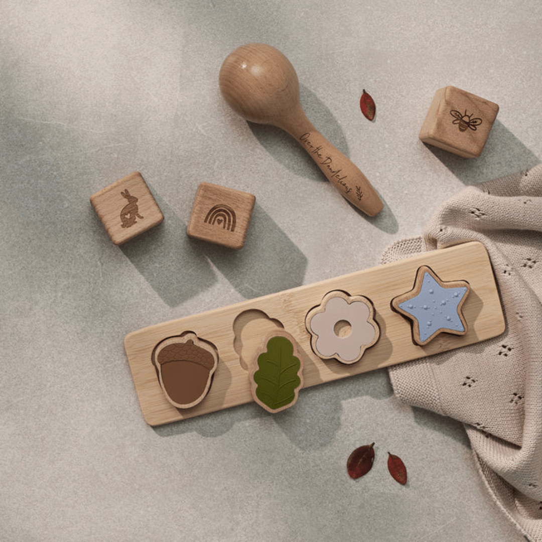 Flatlay-With-Over-The-Dandelions-Wooden-Maraca-And-Blocks-Naked-Baby-Eco-Boutique