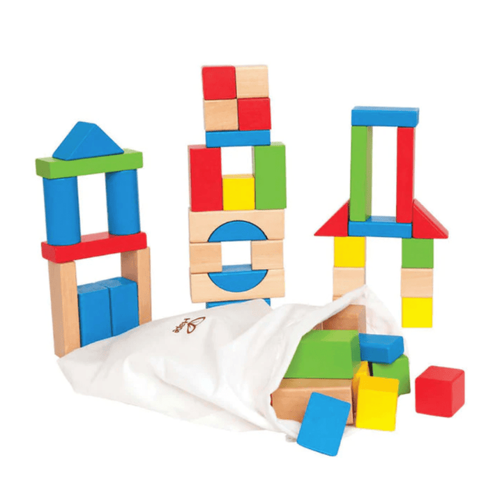 A set of colorful wooden building blocks, painted with child-safe paints and featuring various shapes and colors, arranged into three small structures, with additional blocks spilling from a white cloth bag. Perfect for fostering imaginative play. Introducing the Hape Build Up and Away Blocks by Hape.