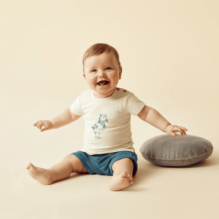 Happy-Little-Boy-Wearing-Wilson-And-Frenchy-Organic-Tie-Front-Shorts-Dark-Blue-Naked-Baby-Eco-Boutique