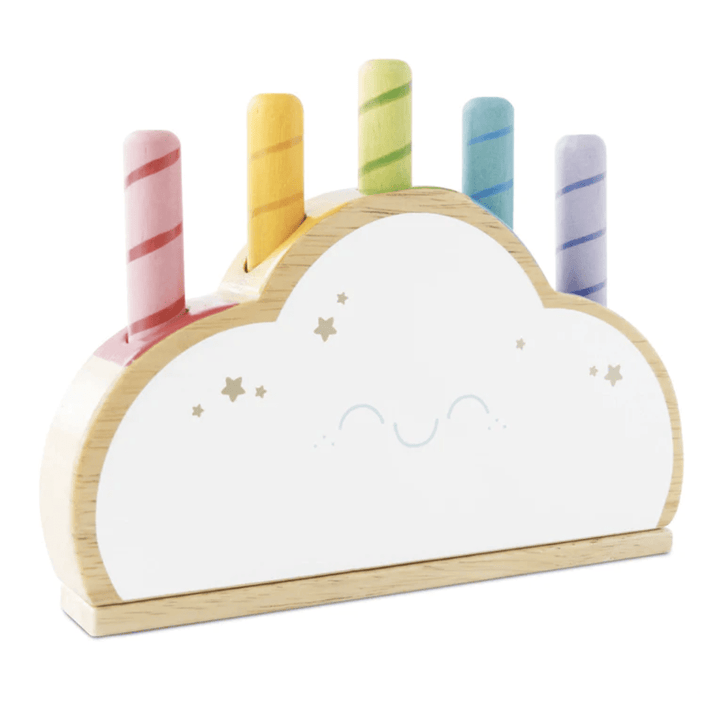 Eco-friendly toddler gift: the Le Toy Van Rainbow Pop Cloud - LUCKY LAST, a charming wooden cloud-shaped organizer with a smiling face. It features five colorful striped pegs in pink, orange, green, blue, and purple. This delightful piece is perfect for playtime and encourages imaginative fun with its vibrant rainbow pop-up rods.