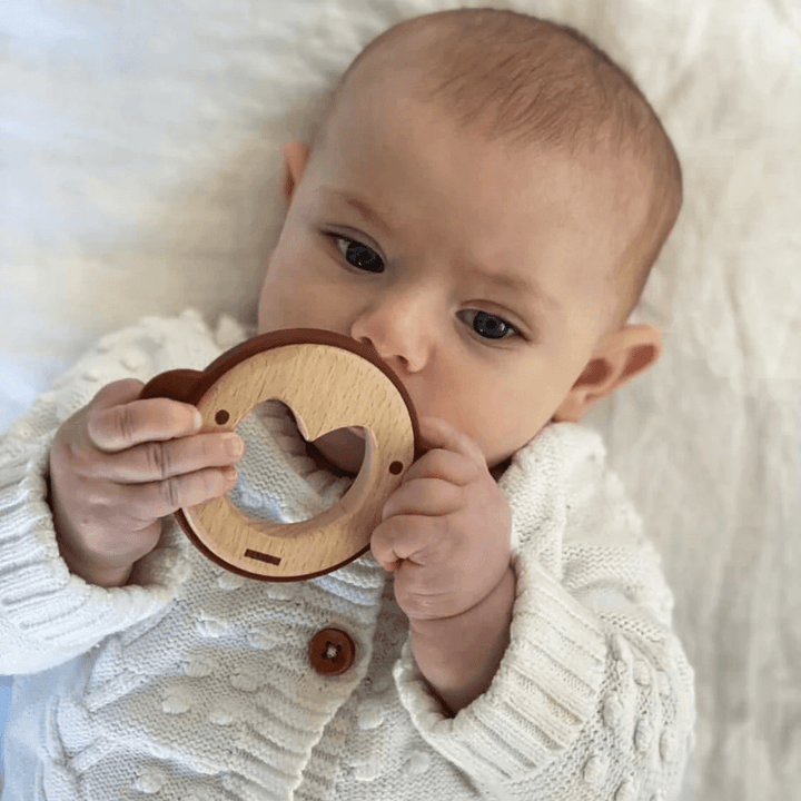 Little-Baby-Chewing-On-Over-The-Dandelions-Wood-And-Silicone-Teether-Mykah-The-Monkey-Naked-Baby-Eco-Boutique