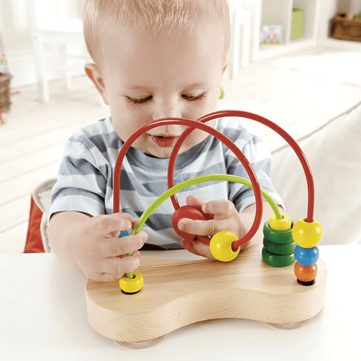 Little-Baby-Playing-With-Hape-Double-Bubble-Bead-Maze-Naked-Baby-Eco-Boutique