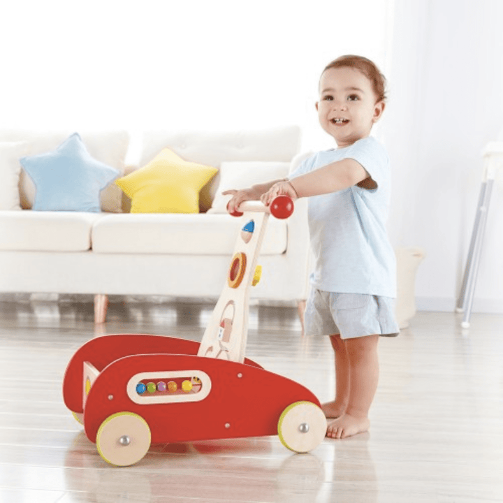 Little-Boy-Waling-Pushing-Hape-Wonder-Walker-Naked-Baby-Eco-Boutique