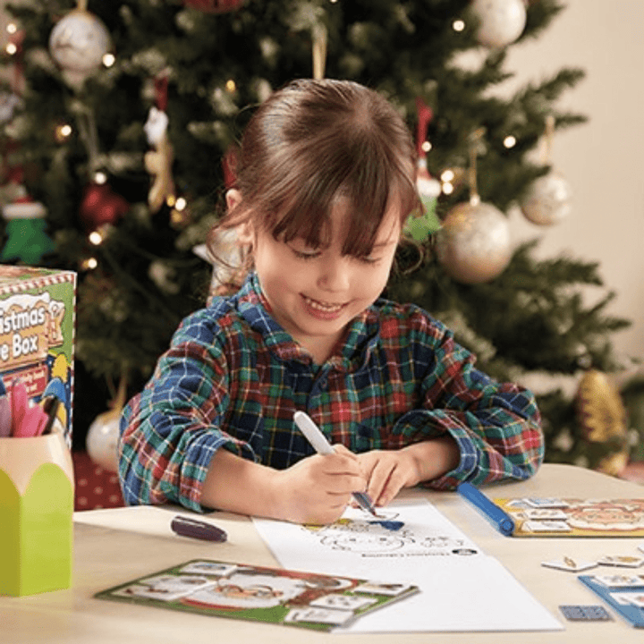 Little-Girl-Colouring-In-With-Orchard-Toys-Christmas-Eve-Box-Earth-Baby-Eco-Boutique