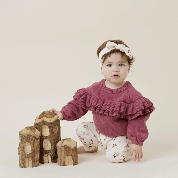 Little-Girl-Kneeling-Wearing-Aster-and-Oak-Organic-Cotton-Leggings-Berry-Naked-Baby-Eco-Boutique