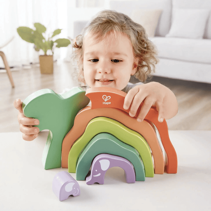 Little-Girl-Putting-Blocks-Together-In-Hape-Stacking-Blocks-Safari-Elephant-Naked-Baby-Eco-Boutique