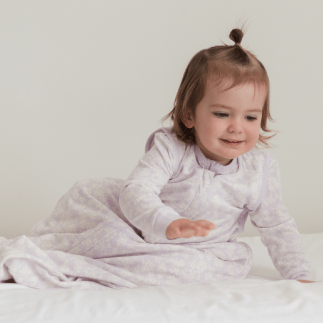 Little-Girl-Wearing-Woolbabe-3-Seasons-Organic-Cotton-Merino-Sleeping-Bag-Mauve-Manuka-Naked-Baby-Eco-Boutique