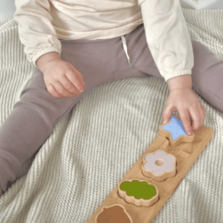 Little-One-Playing-With-Over-The-Dandelions-Wooden-Nature-Puzzle-Naked-Baby-Eco-Boutique