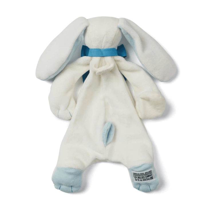 The Maud N Lil Organic Bunny Comforter - Gift Boxed is a plush bunny toy that features long ears, a blue ribbon around its neck, and blue accents on its paws. Made from organic cotton, this comforter is perfect as a baby gift. The tag can be seen on one of the bunny's feet while it lays down, facing upward.