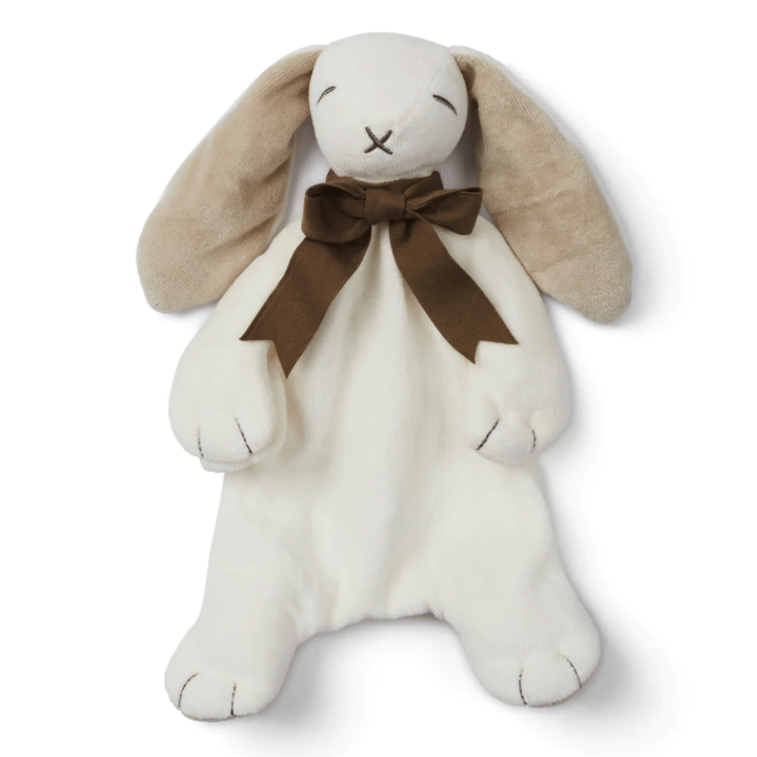 The Maud N Lil Organic Bunny Comforter - Gift Boxed, by Maud N Lil, is a plush toy resembling a rabbit with long beige ears, an off-white body, and a brown bow tied around its neck. Made from organic cotton, this baby gift features a simple stitched facial expression and doubles as a pacifier holder.