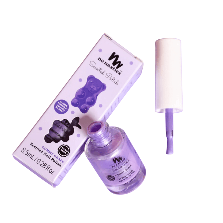 Image of an open bottle of light purple, non-toxic nail polish next to its box and the brush applicator lid. The box displays a gummy bear illustration. The bottle contains 8.5ml of No Nasties 20 FREE Kids Scented Vegan Nail Polish suitable for kids.