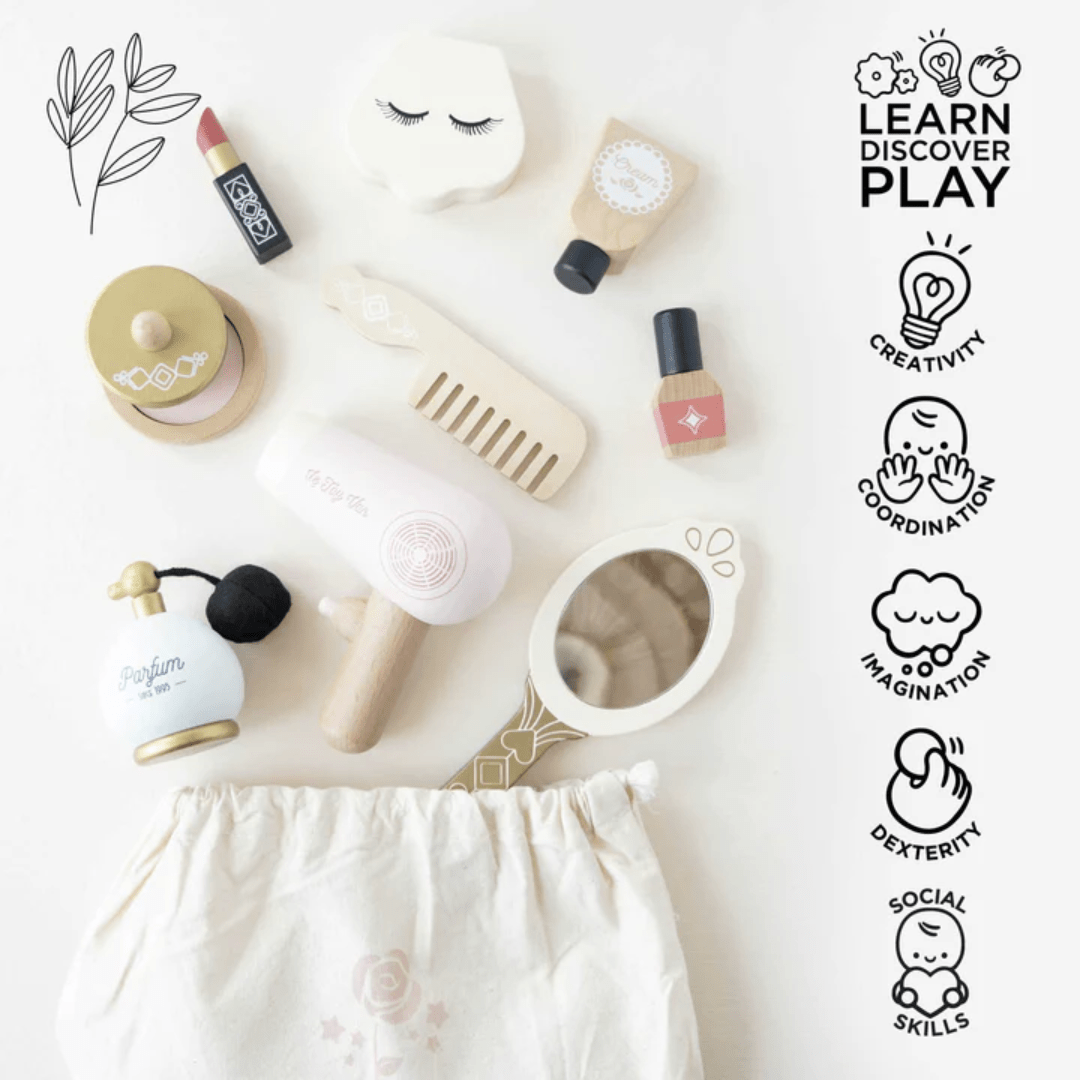Flat lay of children's Le Toy Van Star Beauty Bag and beauty toys with educational skill icons surrounding.