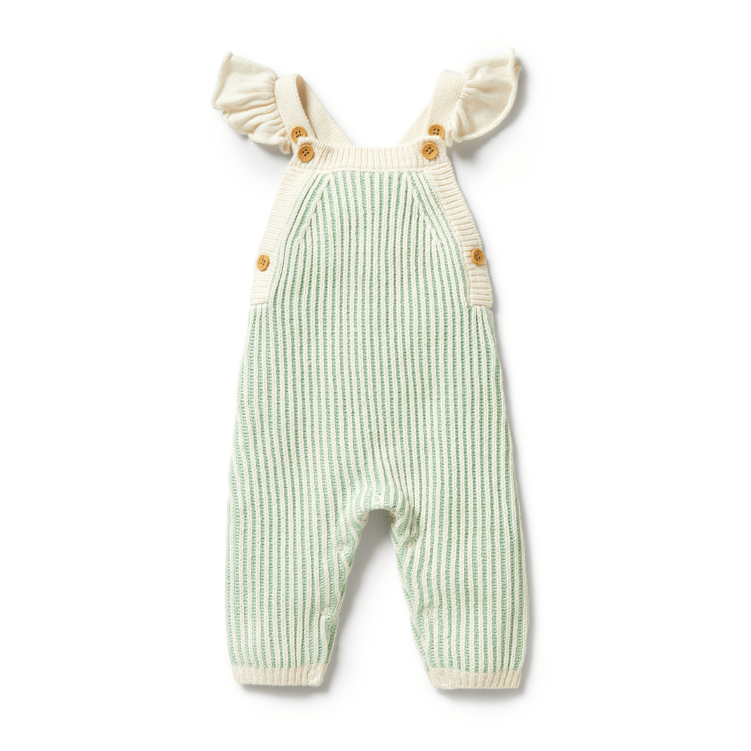 A Dijon-colored knitted ruffle overalls with shoulder straps and wooden buttons by Wilson & Frenchy.