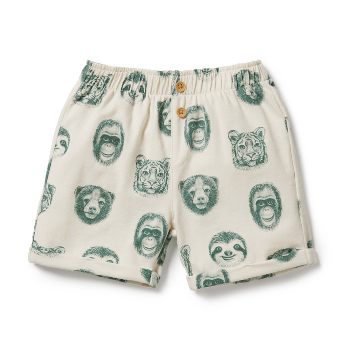 Wilson & Frenchy Organic Cotton Kids Shorts - LUCKY LAST - PETIT PUFFIN - 4 YEARS ONLY, featuring a cream-colored fabric with green illustrations of various animal faces, including a tiger, bear, and sloth. These shorts have an elastic waistband and wooden buttons. Perfect for summer fun, these cute Wilson & Frenchy shorts are both stylish and comfy.