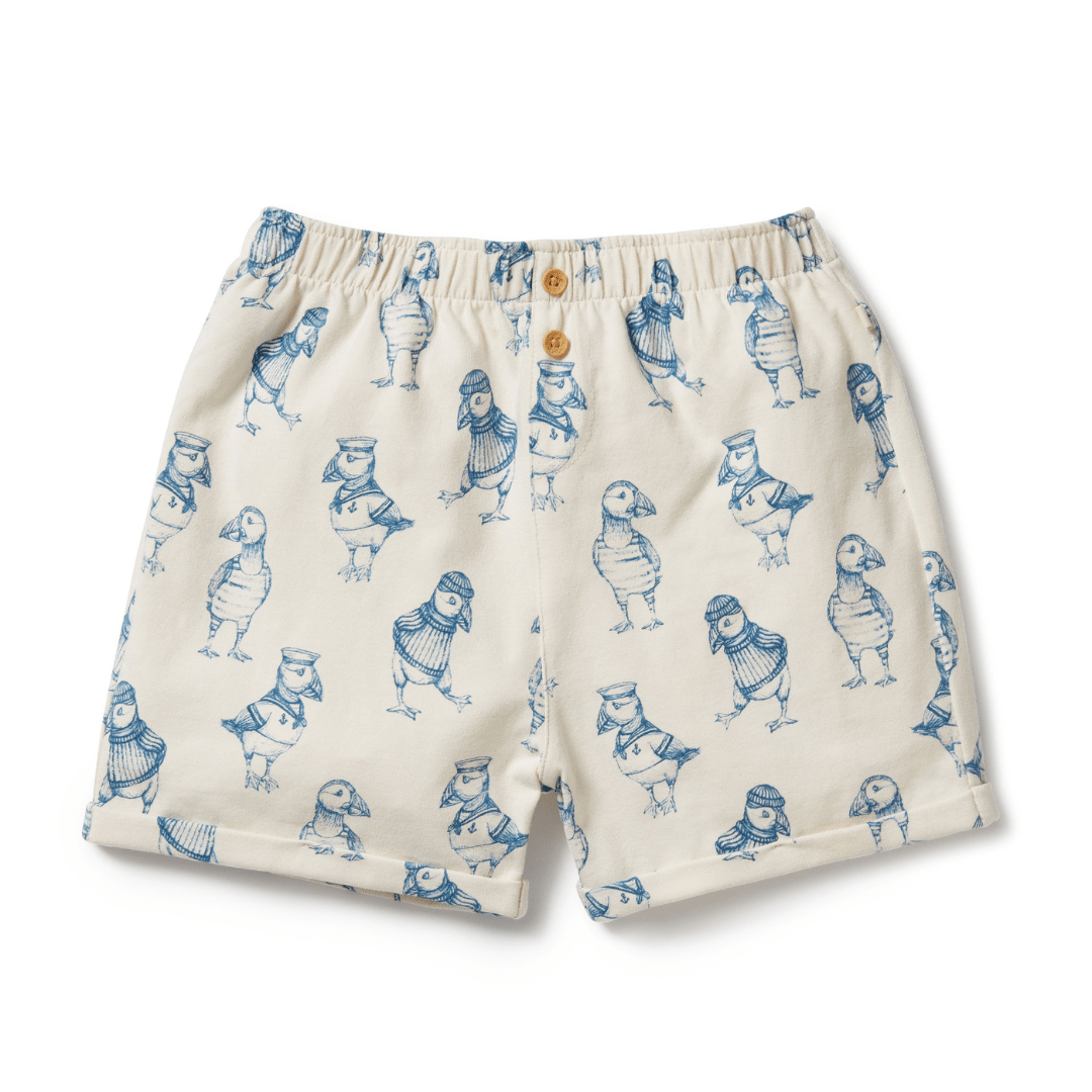 Wilson & Frenchy Organic Cotton Kids Shorts - LUCKY LASTS - 4 & 5 YEARS ONLY featuring a pattern of blue cartoon birds wearing sailor outfits. These organic cotton shorts have an elastic waistband and a single button at the front, making them lightweight, breathable summer staples.