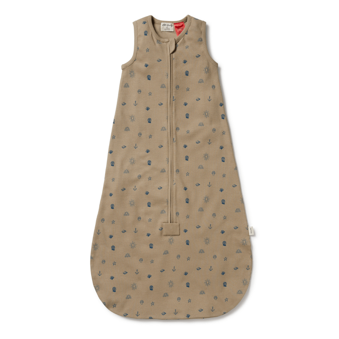 A Wilson & Frenchy Organic Rib Summer Sleeping Bag in tan with blue dots.