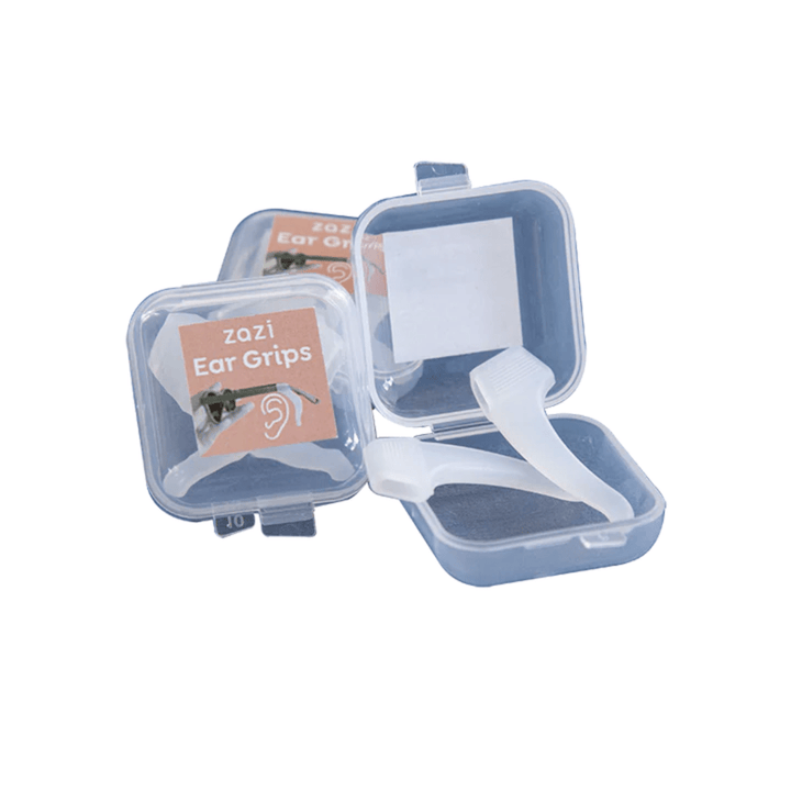 Three clear plastic containers with a label reading "Zazi Ear Grips," contain white ear grip devices. One container is open, exposing the contents, perfect for those with a low nose bridge who wear Zazi shades.