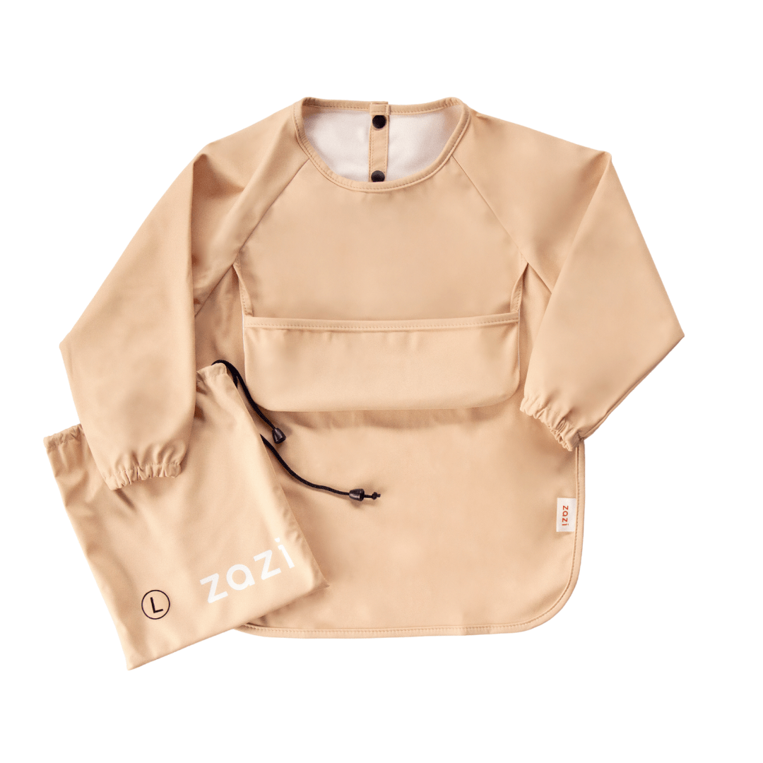 The Zazi recycled full-sleeved bib transforms into a practical and eco-friendly ensemble, featuring a beige long-sleeve apron with a front pocket and a matching drawstring bag, both branded with "Zazi.