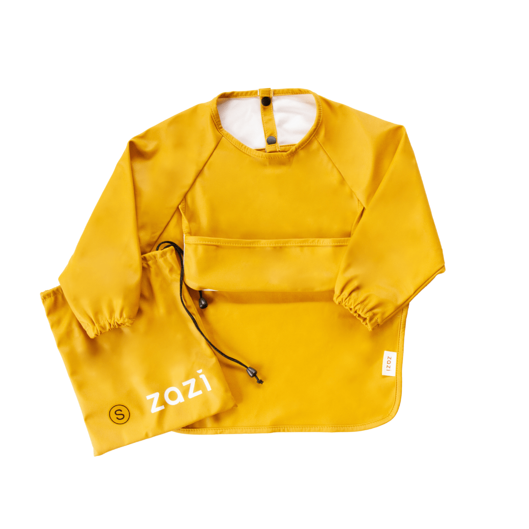 The Zazi Recycled Full-Sleeved Bib in yellow features a neck closure, front pocket, and elastic cuffs. It comes with a matching drawstring pouch that has the Zazi brand name printed on it. These bibs are both machine washable and waterproof, providing excellent stain resistance.