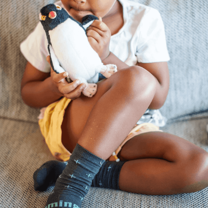 Adorable-Boy-Holding-Penguin-Wearing-Lamington-Merino-Wool-Crew-Child-Socks-Cactus-Naked-Baby-Eco-Boutique