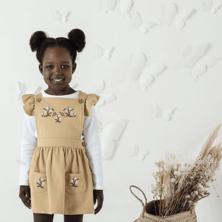 Aster-And-Oak-Organic-Cotton-Embroidered-Pinafore-Dress-Taupe-Floral-On-Little-Girl-Naked-Baby-Eco-Boutique