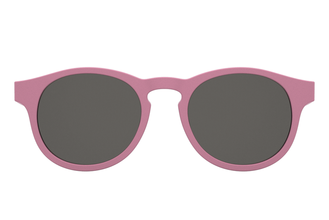 Babiators Keyhole Baby & Kids Sunglasses (Multiple Variants) with flexible rubber frames and black lenses, providing 100% UVA and UVB protection against a plain background.