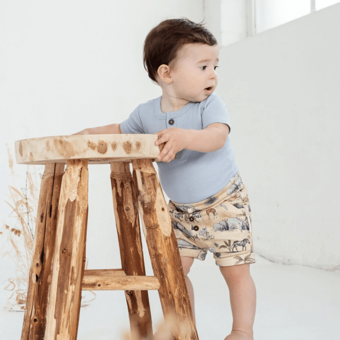 Baby-Holding-Stool-Wearing-Aster-and-Oak-Organic-Cotton-Safari-Pocket-Shorts-Naked-Baby-Eco-Boutique