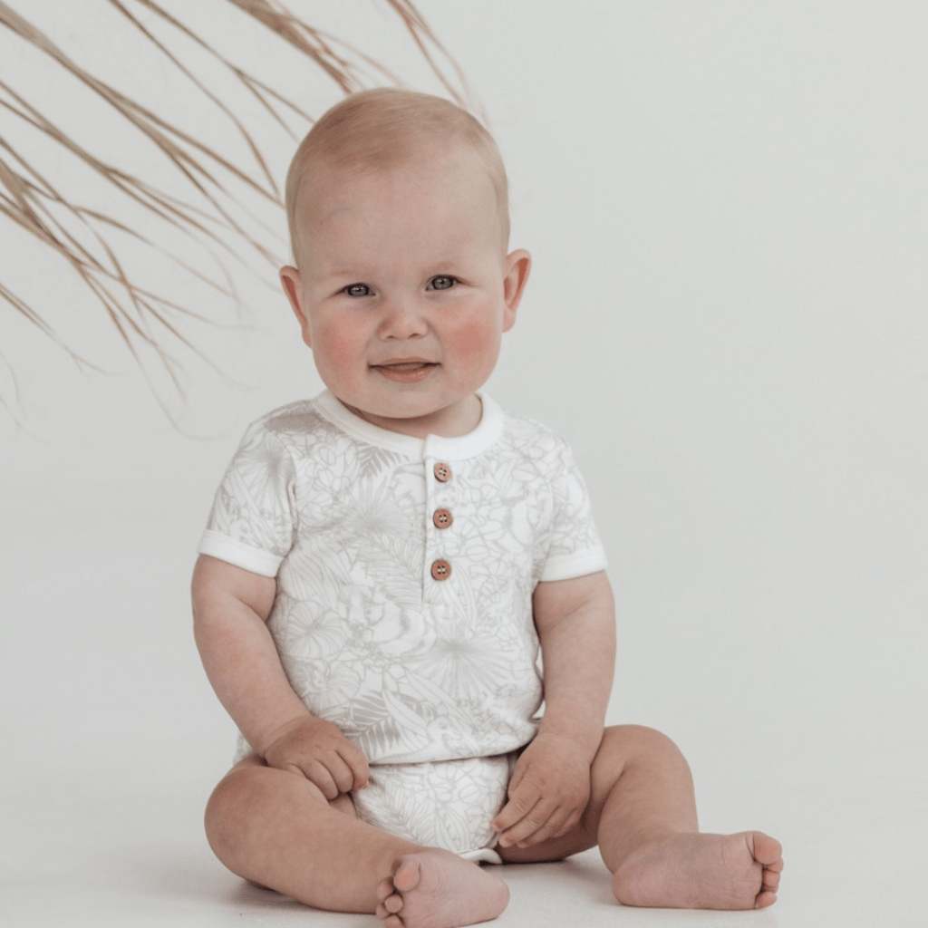 Baby-Smiling-Wearing-Aster-and-Oak-Organic-Animal-Henley-Onesie-Naked-Baby-Eco-Boutique