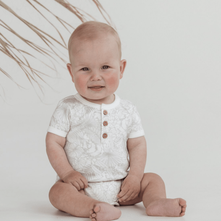 Baby-Smiling-Wearing-Aster-and-Oak-Organic-Animal-Henley-Onesie-Naked-Baby-Eco-Boutique