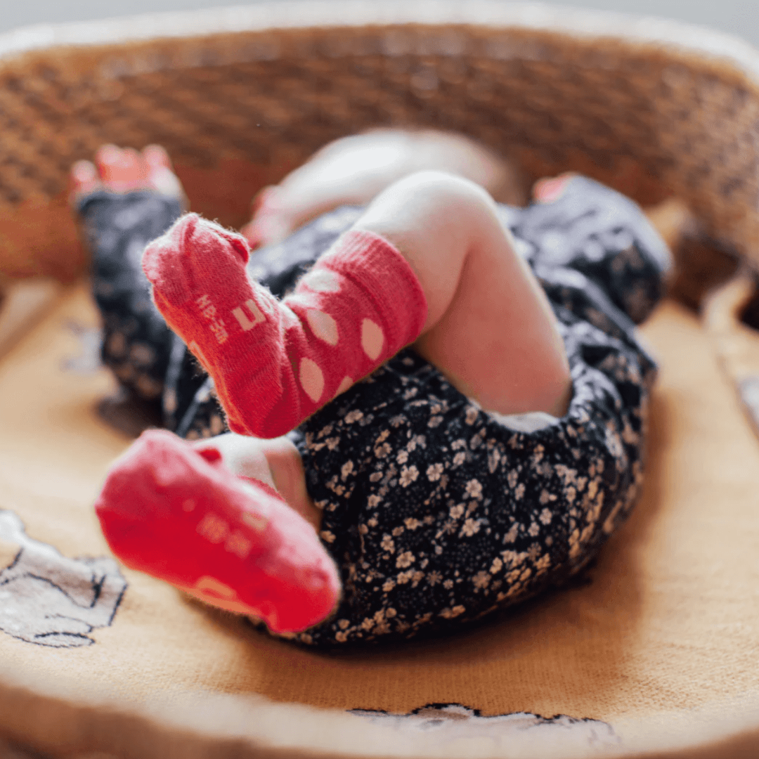 Close-up-of-New-Baby-Feet-Wearing-Lamington-Merino-Wool-Crew-Baby-Socks-Pippa-Naked-Baby-Eco-Boutique