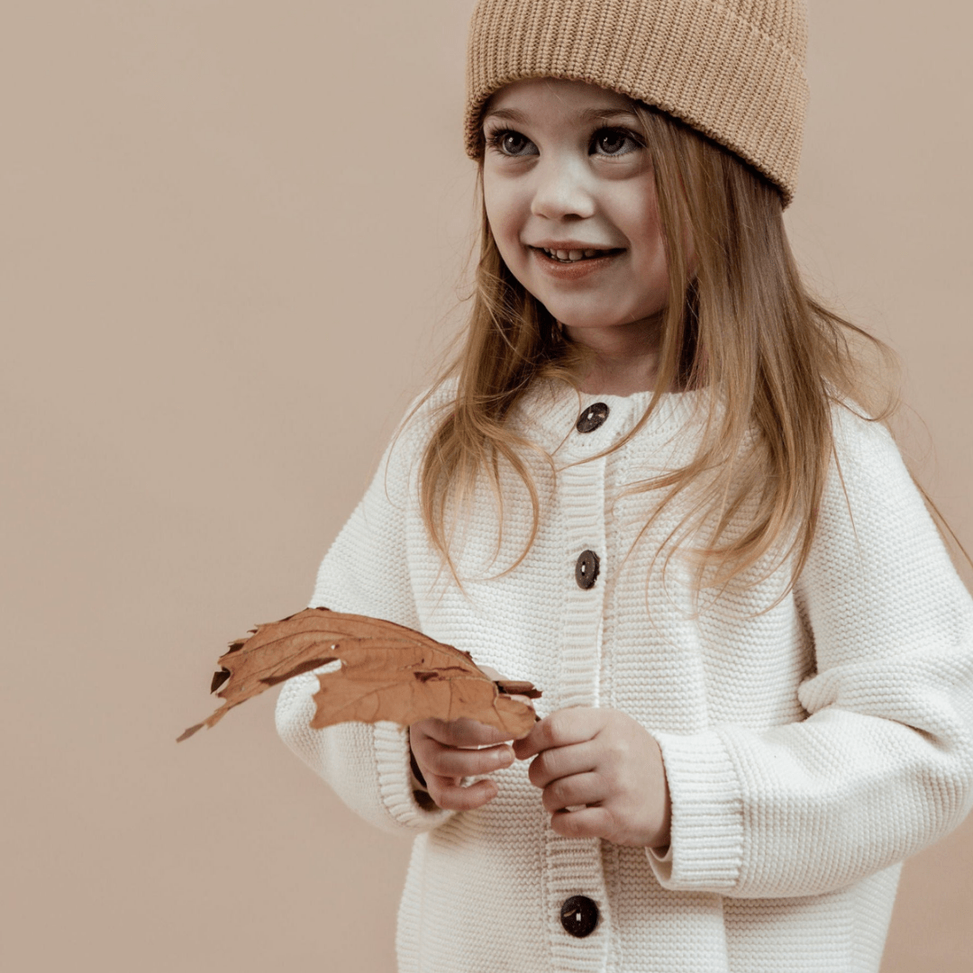 Happy-Girl-Wearing-Aster-And-Oak-Organic-Chunky-Knit-Cardigan-Off-White-Naked-Baby-Eco-Boutique