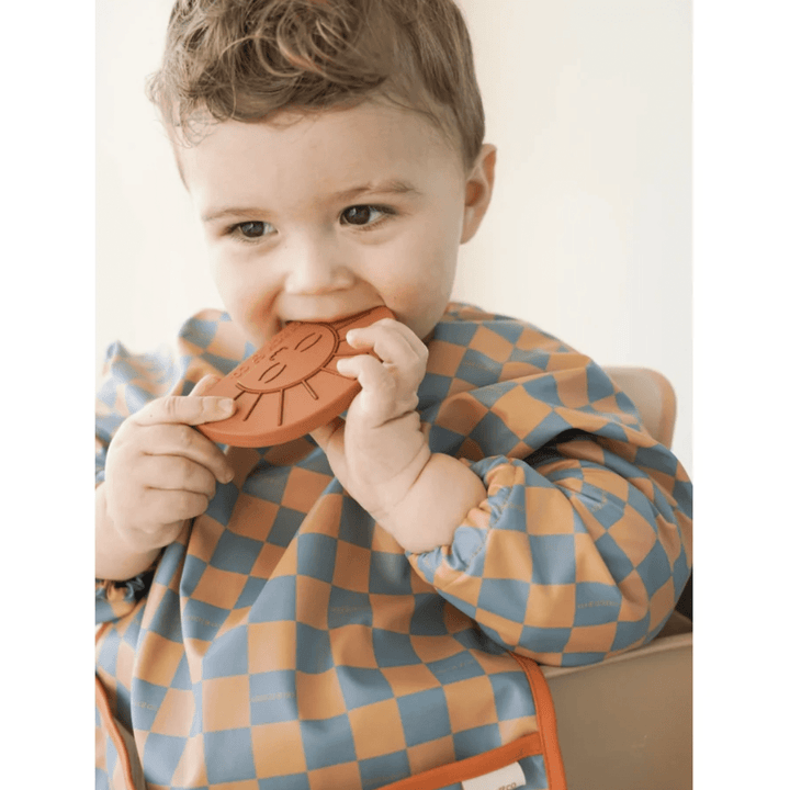 Little-Boy-Wearing-Grech-And-Co-Recycled-Smock-Bib-Checks-Laguna-And-Wheat-Naked-Baby-Eco-Boutique