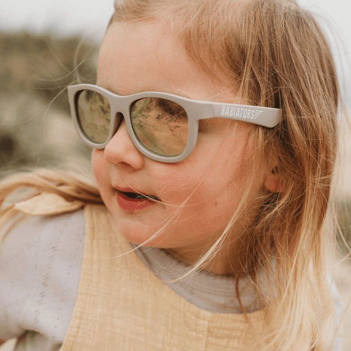 Little-Girl-Smiling-Wearing-Babiators-Polarized-Navigators-Baby-Kids-Sunglasses-The-Hipster-Naked-Baby-Eco-Boutique