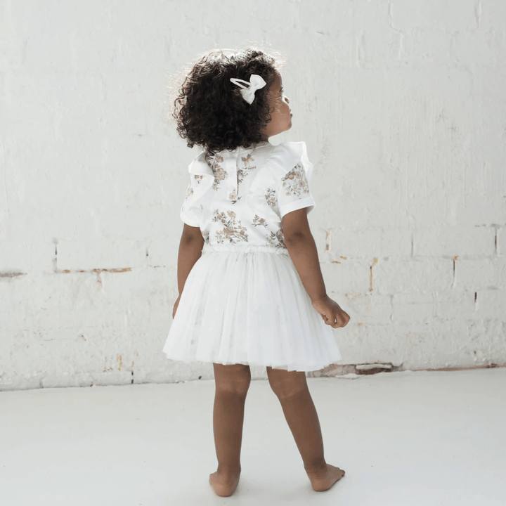 Little-Girl-Wearing-Aster-And-Oak-Organic-Cotton-Primrose-Tutu-Dress-Naked-Baby-Eco-Boutique