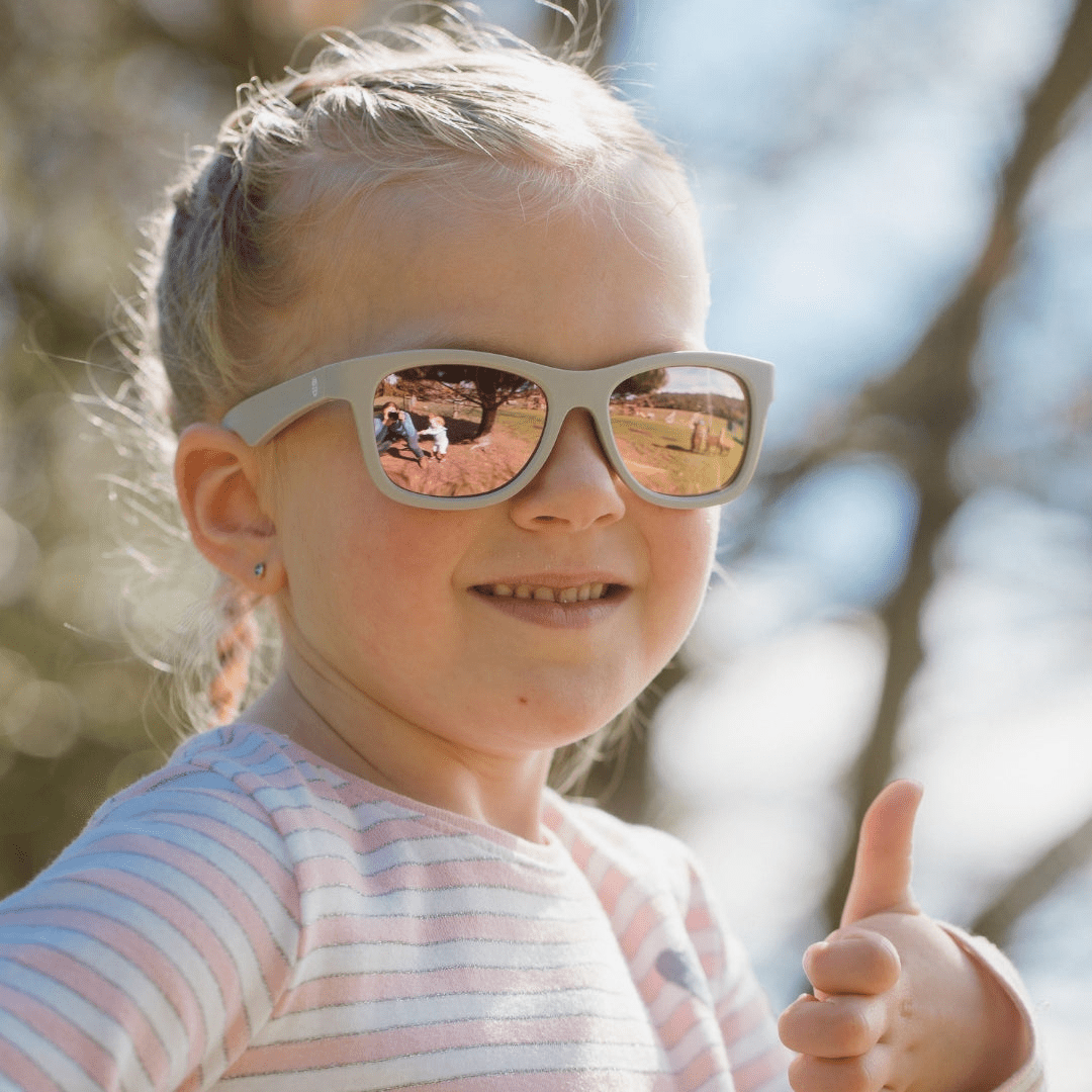 Smiling-Girl-Wearing-Babiators-Polarized-Navigators-Baby-Kids-Sunglasses-The-Hipster-Naked-Baby-Eco-Boutique