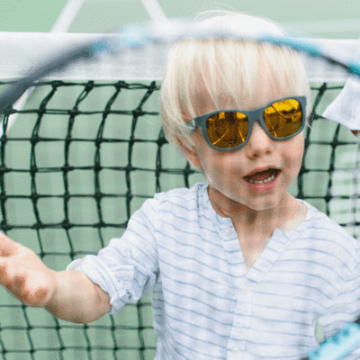 Little-Boy-Wearing-Babiators-Polarized-Babiators-Baby-Kids-Sunglasses-The-Islander-Naked-Baby-Eco-Boutique